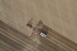 An aerial overhead shot of fertilizer machine in a farming
